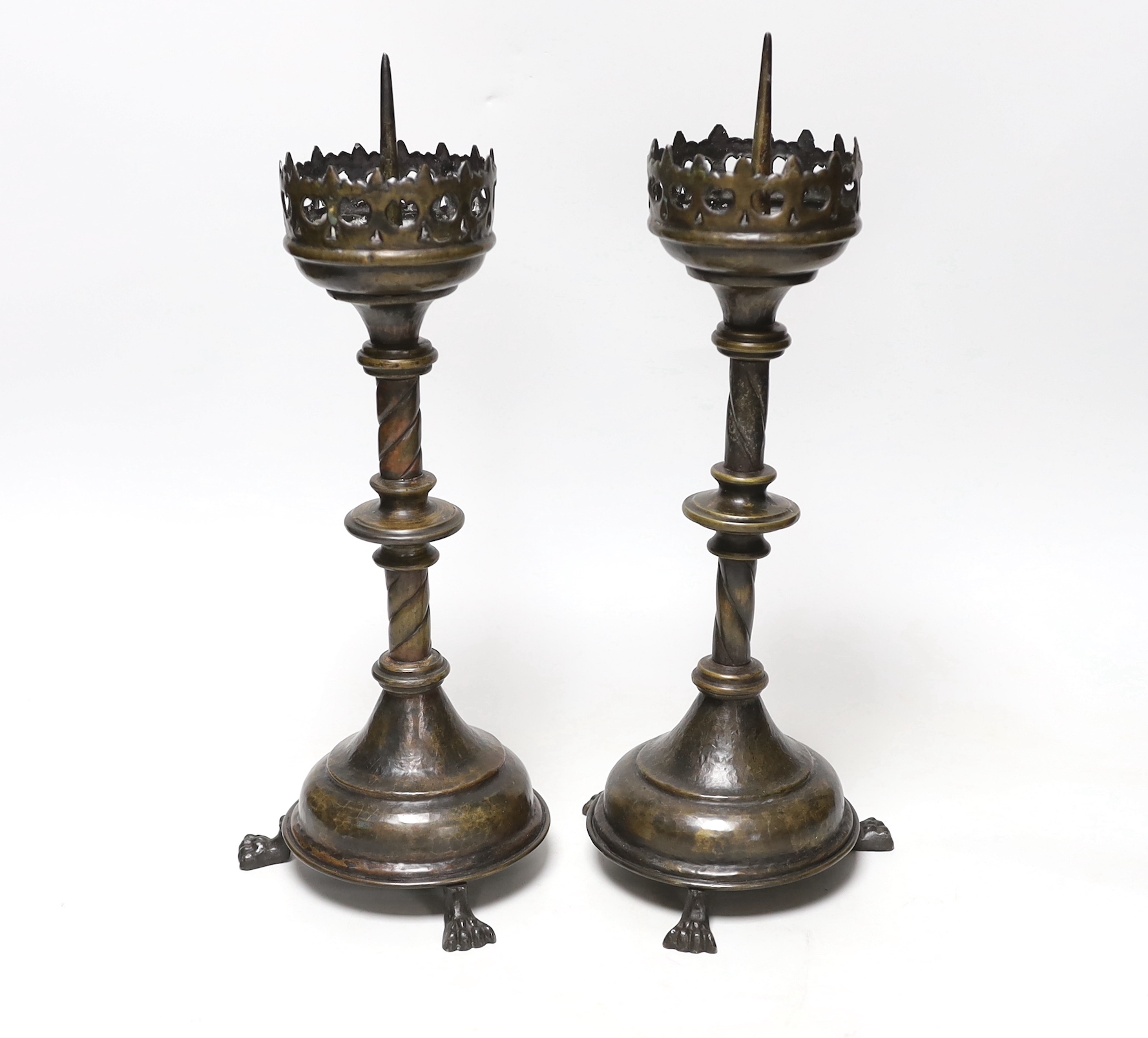 A pair of 19th century pricket candlesticks, 34cm